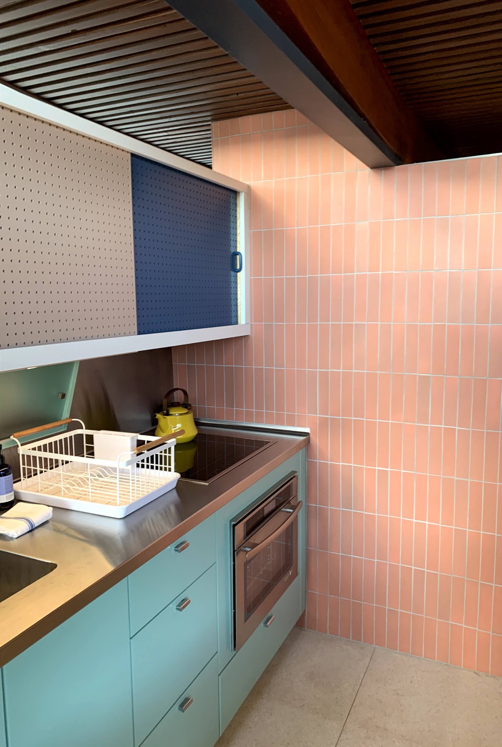 Kitchen restored to resemble original cabinets and wall tile